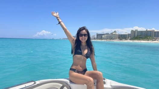 girlon the boat nearby Hotel Riu, Cancun, Mexico