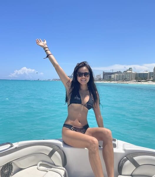 girlon the boat nearby Hotel Riu, Cancun, Mexico