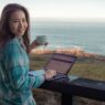girl-working-laptop-digital-nomad-Timber-Cove-Resort-California-USA