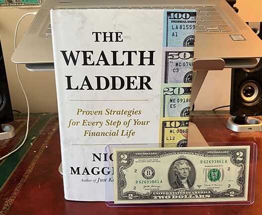 wealth ladder book + $2 note