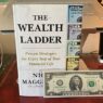 wealth ladder book + $2 note
