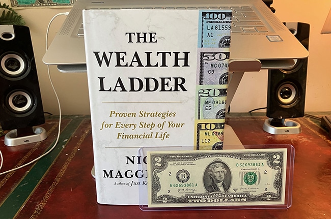wealth ladder book + $2 note