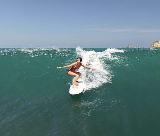 surfing girl, lombok indonesia